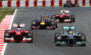 Nico Rosberg holds off Fernando Alonso early in the race