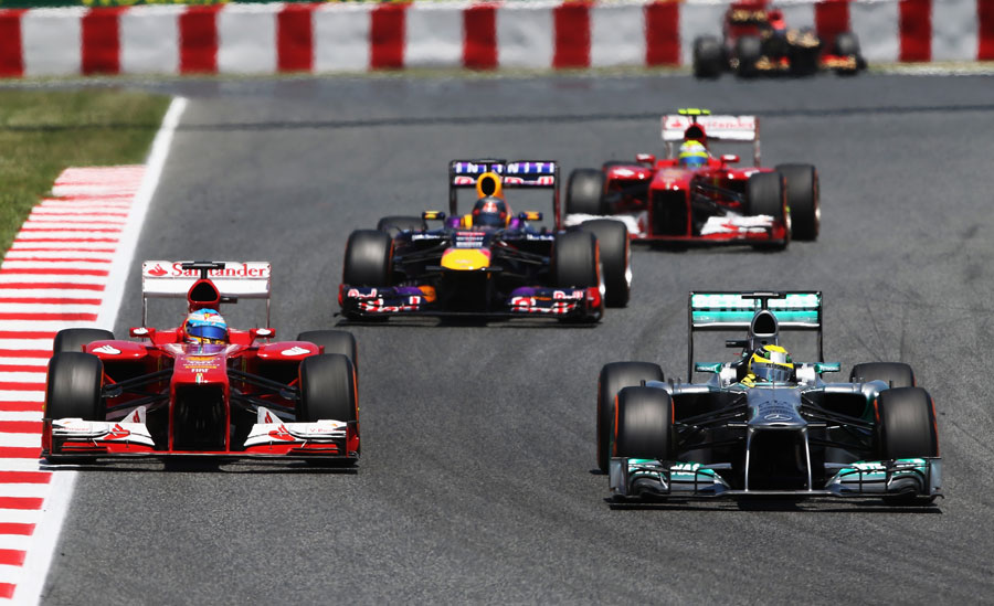 Nico Rosberg holds off Fernando Alonso early in the race