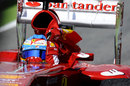 Fernando Alonso celebrates with a Spanish flag