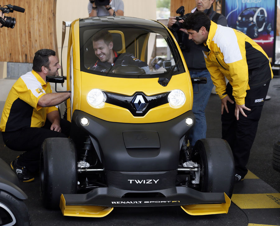 Sebastian Vettel drives a Renault F1 Twizy on a visit to Viry