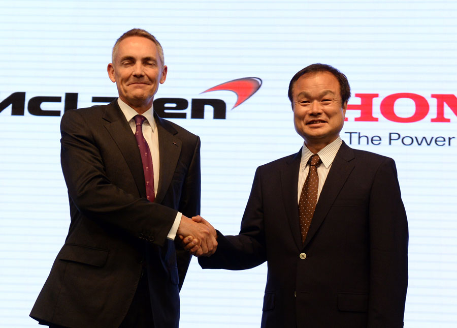 Martin Whitmarsh shakes hands Honda president Takanobu Ito after agreeing an engine supply deal from 2015