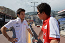 Sergio Perez chats to former Sauber team-mate Kamui Kobayashi in the pit lane