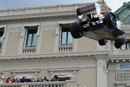 Spectators watch on as Adrian Sutil's Force India is lifted away from the circuit