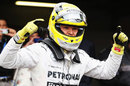 Nico Rosberg celebrates after securing his third consecutive pole position