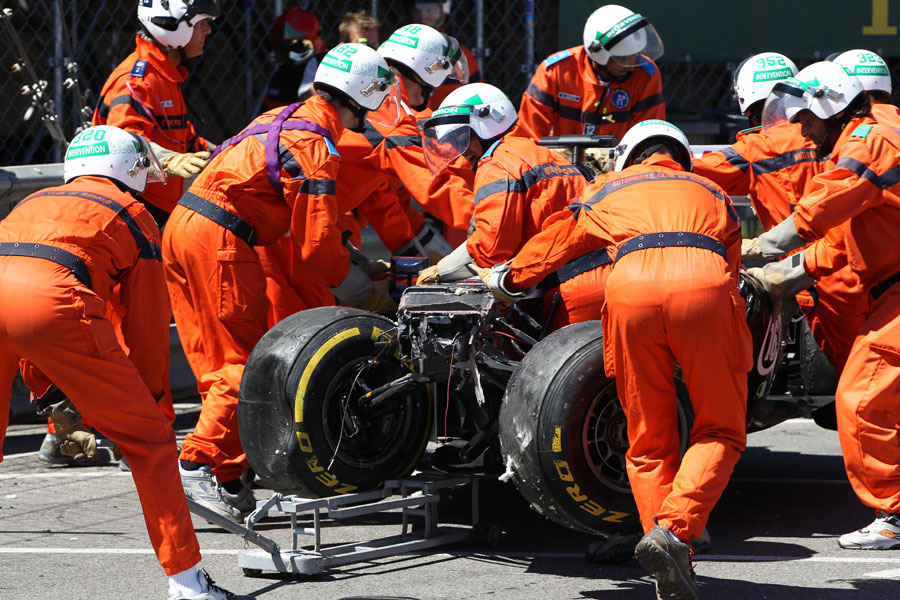 Marshals work to clear Pastor Maldonado's wrecked Williams