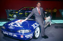 Mondeo Man: Nigel Mansell poses for photos with his BTCC Ford Mondeo