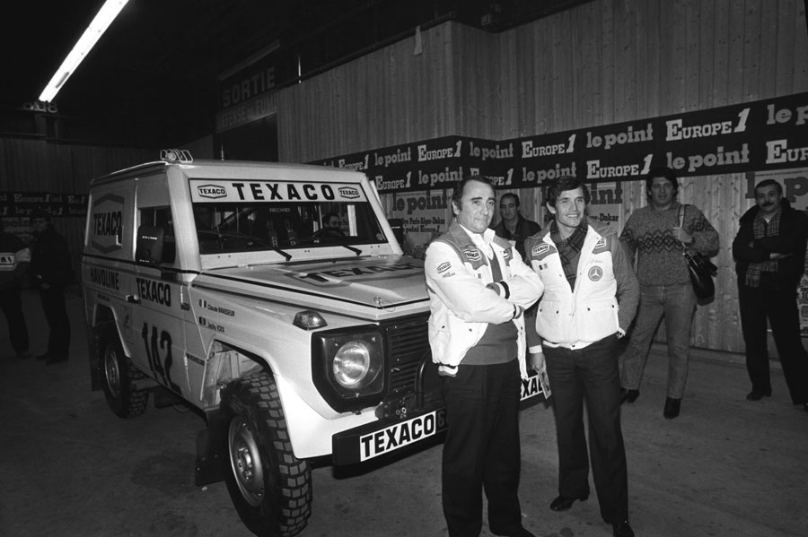 Jacky Ickx and Claude Brasseur with their car during the Paris Dakar race presentation