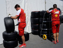 Ferrari mechanics check the tyres on arrival in Canada