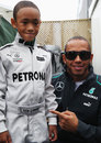 Lewis Hamilton poses for a photo with a young look-a-like fan