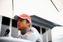 Jenson Button faces the press outside McLaren hospitality