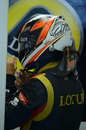 Kimi Raikkonen prepares for practice in the Lotus garage