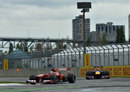 Fernando Alonso leads Sebastian Vettel through the final chicane