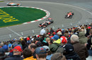 Jenson Button leads a Marussia and a Force India through the hairpin