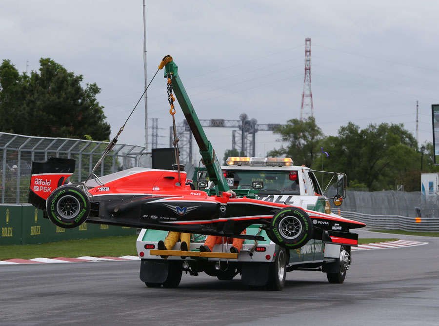 Jules Bianchi's Marussia is returned to the pits
