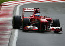 Fernando Alonso holds a slide in the Ferrari