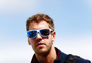Sebastian Vettel arrives in the paddock on Sunday