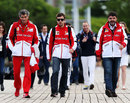 Fernando Alonso walks to the paddock on race day morning