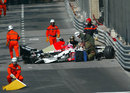 Doctors arrive on the scene to treat Jenson Button after the BAR driver crashed at the Nouvelle Chicane