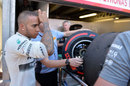 Lewis Hamilton inspects his Pirelli tyres