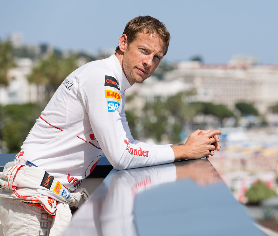 Jenson Button poses during a publicity photoshoot in Cannes