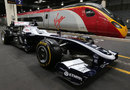A Williams car on display alongside a Virgin train to promote train travel for the British Grand Prix