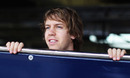 Sebastian Vettel looks out of the Red Bull garage