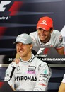 Jenson Button shares a joke with Michael Schumacher at the drivers' press conference 