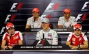 McLaren and Ferrari drivers flank seven-time world champion Michael Schumacher in Bahrain