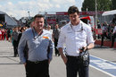 Paul Hembery talks to Toto Wolff in the pit lane