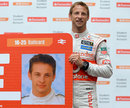 Jenson Button with a young photograph of himself at a sponsors event