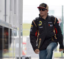 Kimi Raikkonen arrives in the paddock on Thursday 
