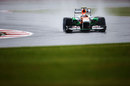 Adrian Sutil negotiates his way round in the wet
