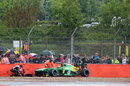 Charles Pic's Caterham lies prone in the wall at the final corner