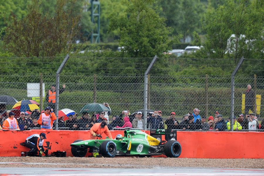 Charles Pic's Caterham lies prone in the wall at the final corner