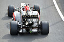 The Lotus of Kimi Raikkonen leaves the pits