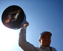 Nico Rosberg celebrates on top of his Mercedes