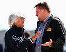 Bernie Ecclestone talks with Paul Hembery in the paddock