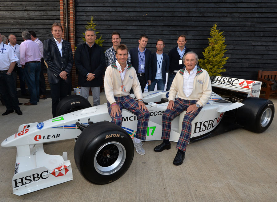 Sir Jackie Stewart and Paul Stewart pose with an SF3 at a Stewart Grand Prix reunion