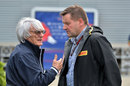Bernie Ecclestone talks with Paul Hembery in the paddock