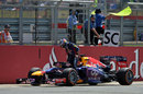 Sebastian Vettel climbs out of his Red Bull after retiring