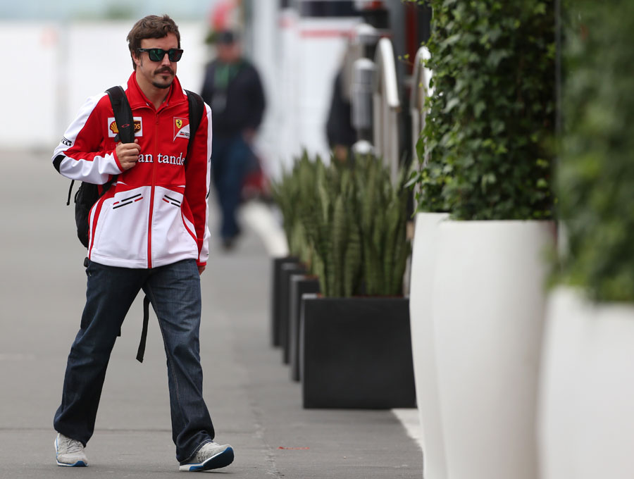 Fernando Alonso arrives at the circuit on Friday