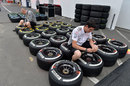 McLaren mechanics work on the team's allocation of tyres