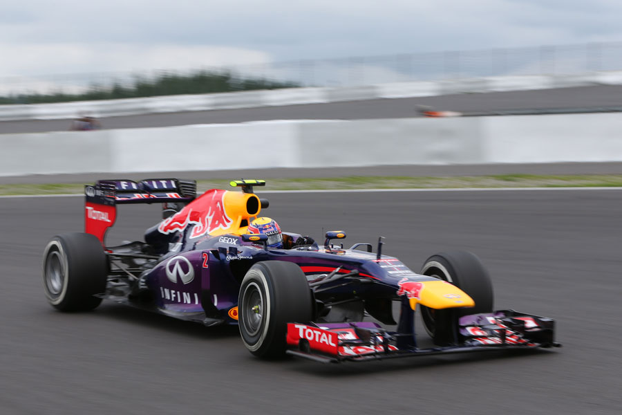 Mark Webber attacks the turn four in his Red Bull