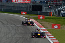 Sebastian Vettel leads Mark Webber early in the race