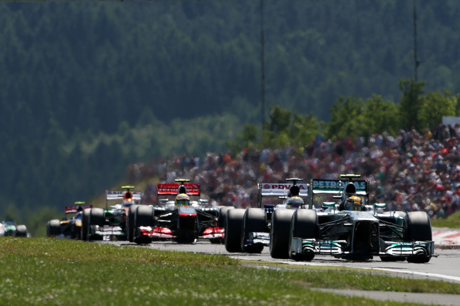Lewis Hamilton leads a gaggle of cars 