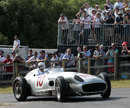 Sir Stirling Moss arrives at the top of the hillcimb in a Mercedes W196