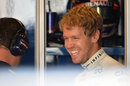 Sebastian Vettel is all smiles in the Red Bull garage