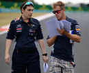 Sebastian Vettel walks the track with Red Bull performance engineer Tim Malyon