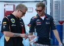 Sebastian Vettel and Kimi Raikkonen share a joke after practice