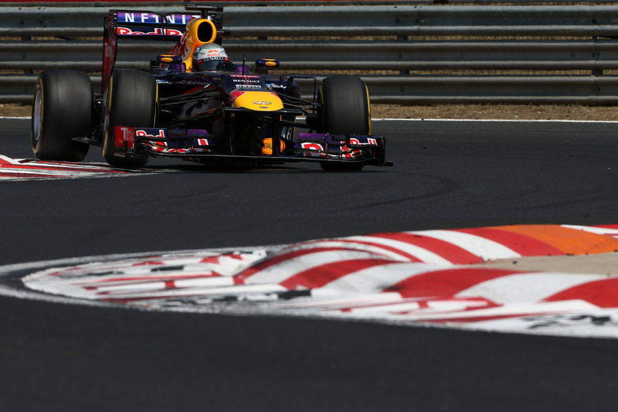 Sebastian Vettel attacks the chicane on soft tyres